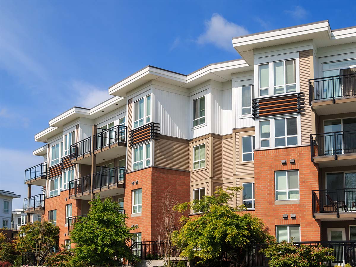 Person sticking a pin into a city map