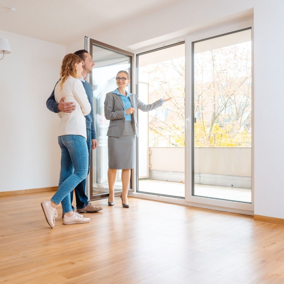 A couple taking a tour of an apartment.