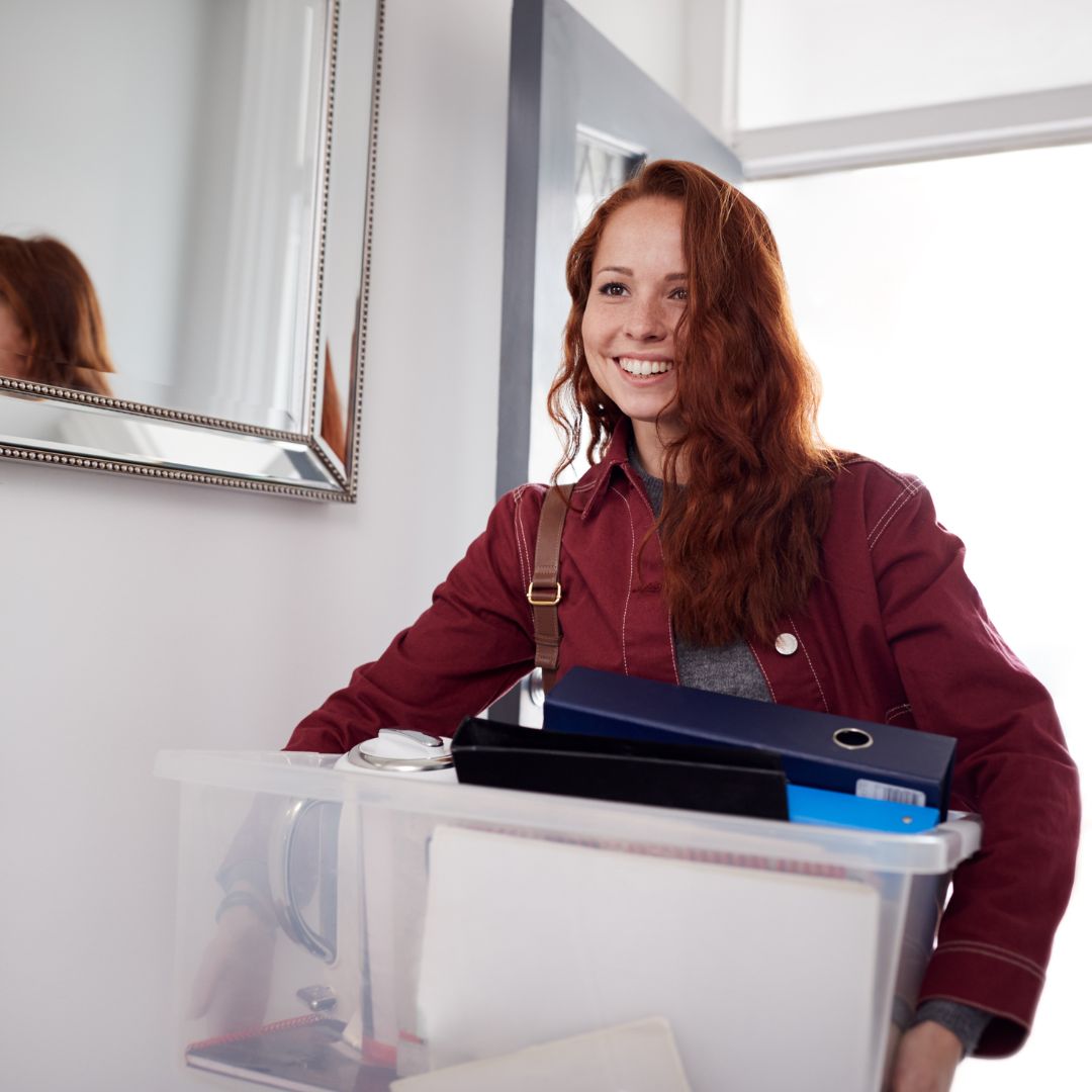 Person moving in with a box