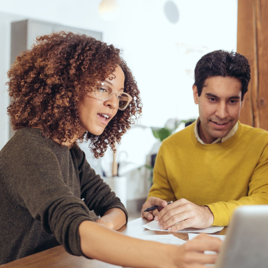 agent showing person stuff on ipad