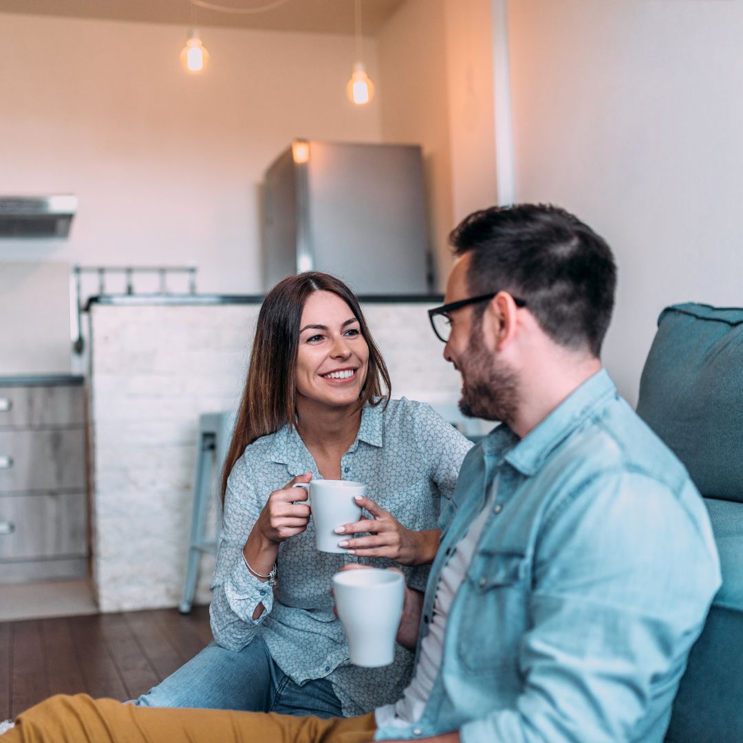 happy couple in new home
