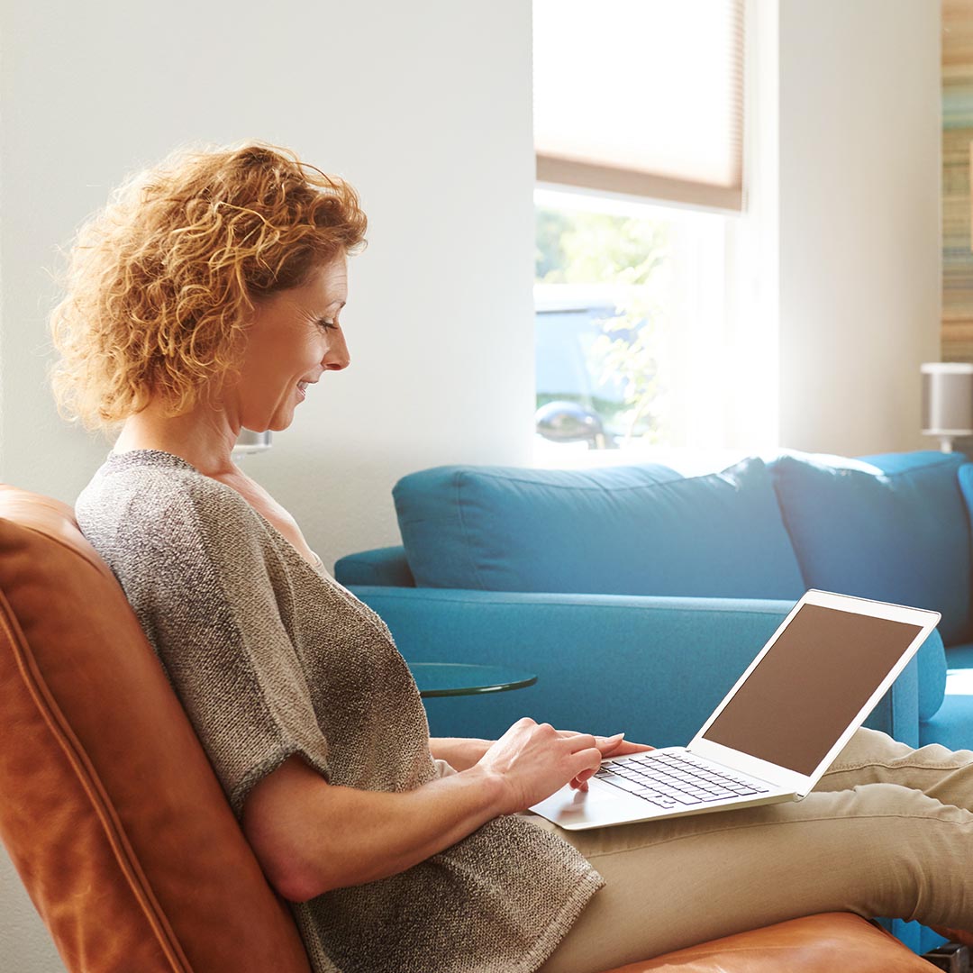 happy woman using a laptop