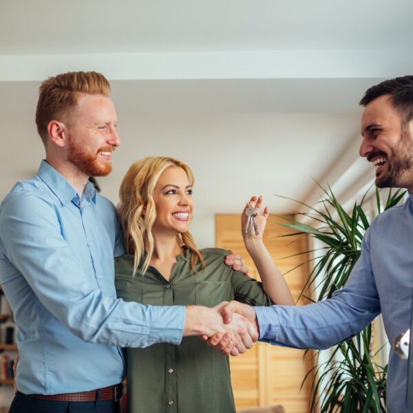 shaking hands with an apartment finder