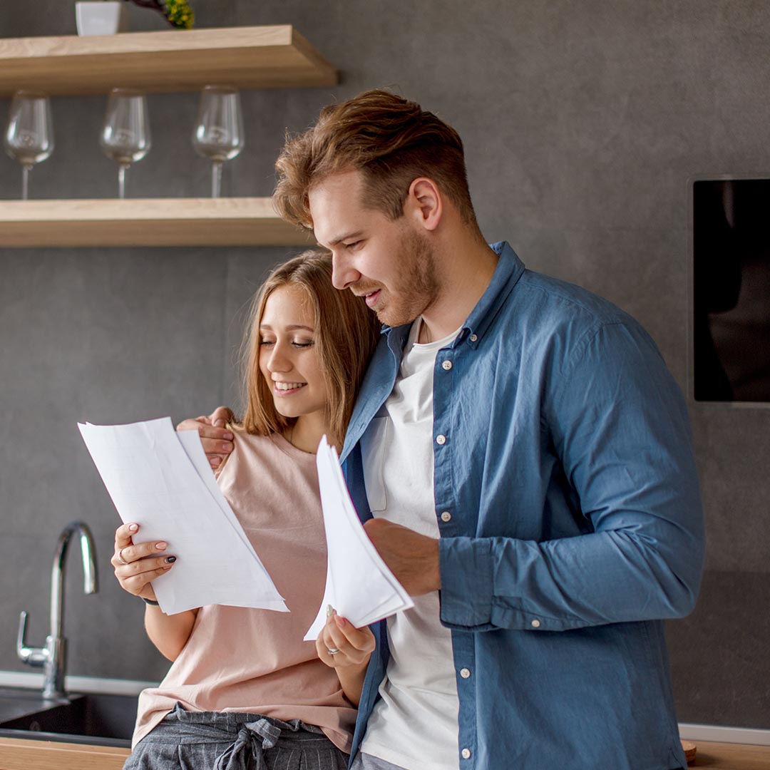 happy couple going over their budger