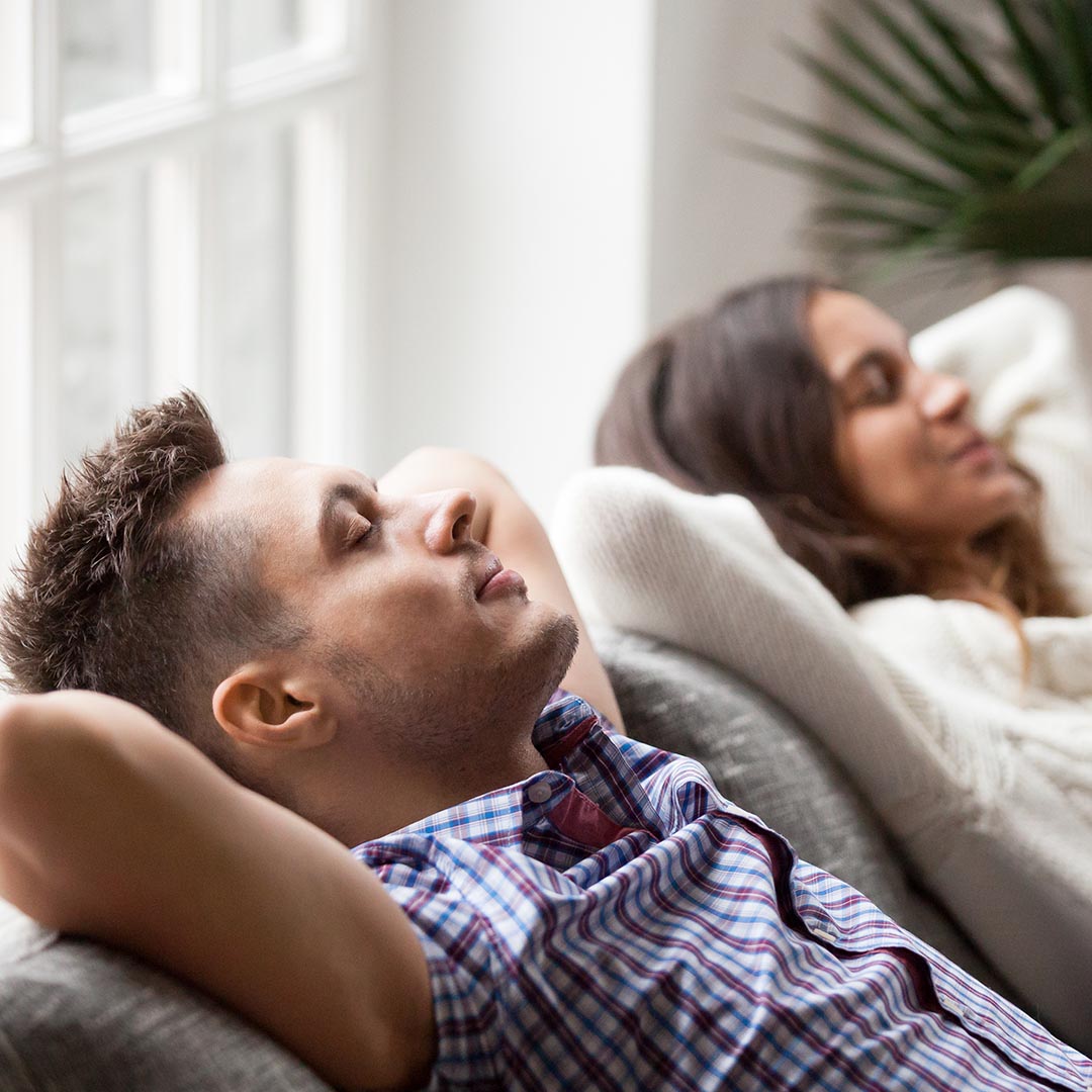 couple relaxing on the sofa