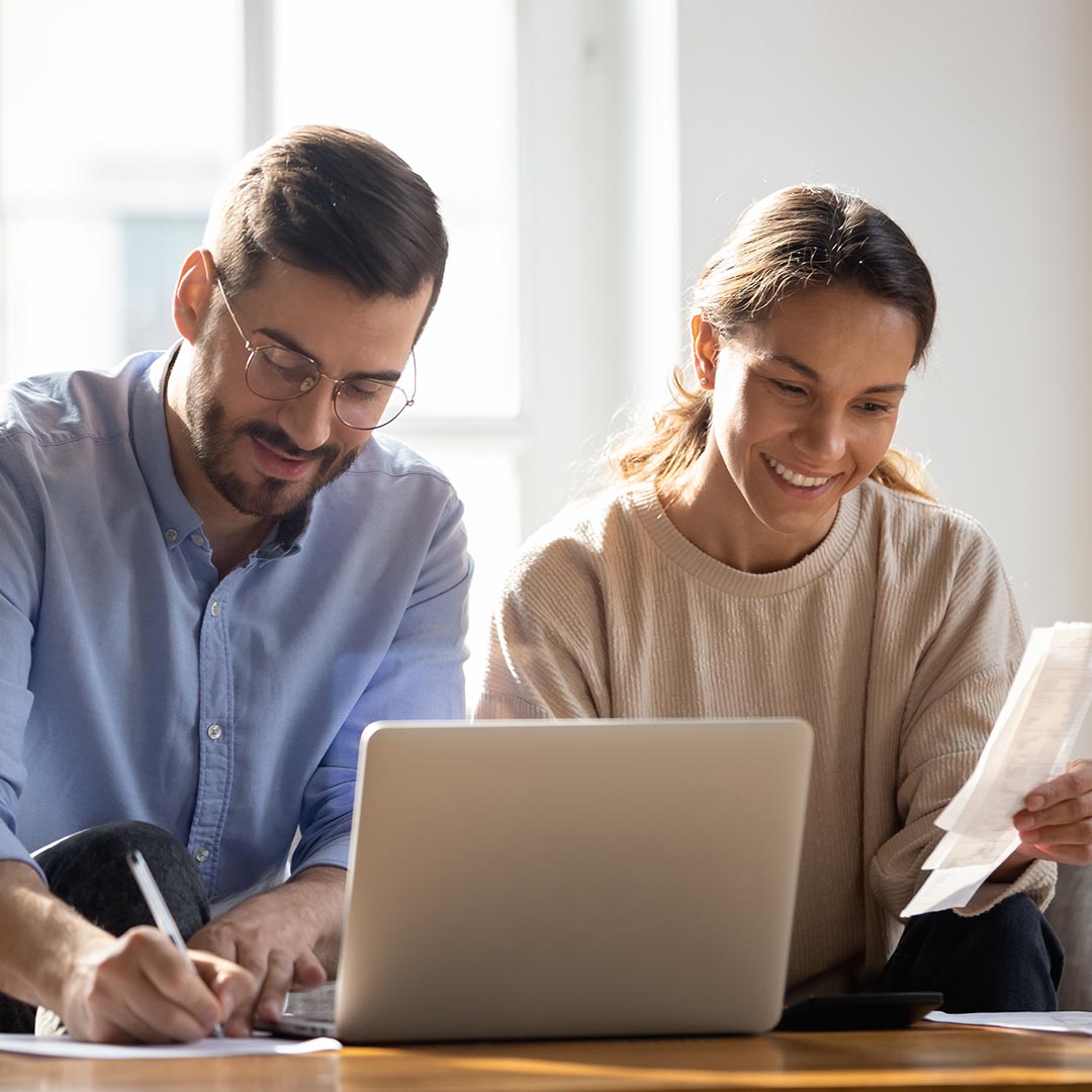 smiling couple going over budget