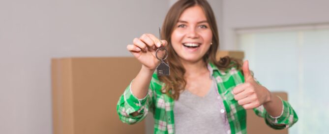 Holding keys to first apartment