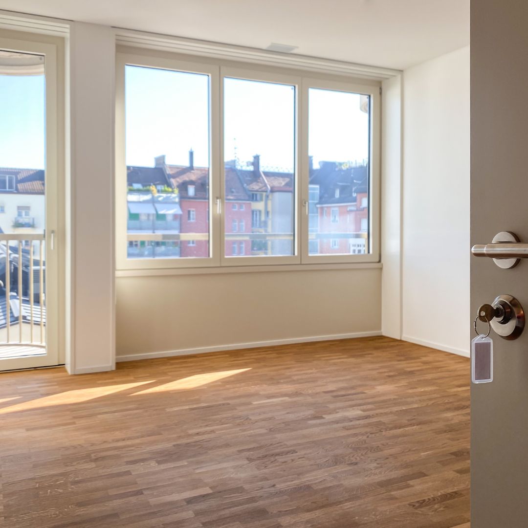 Empty apartment with large windows