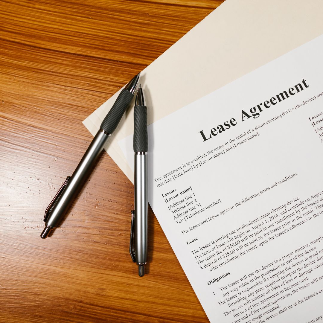 lease agreement and two pens