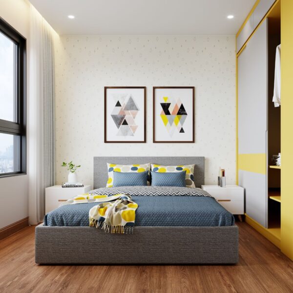 two paintings over a bed in a studio apartment 