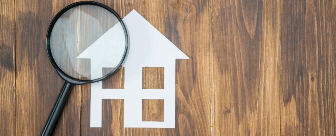 Apartment and magnifying glass.